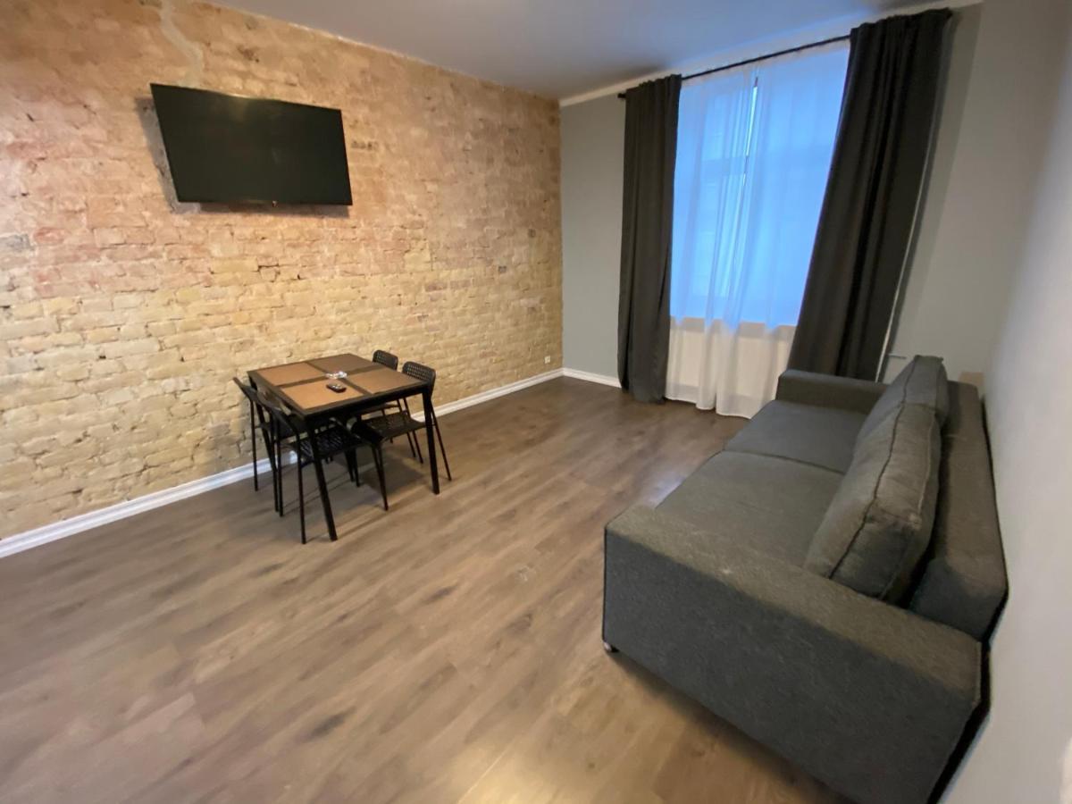 Aparthotel Riga Exterior foto A living room in a typical apartment