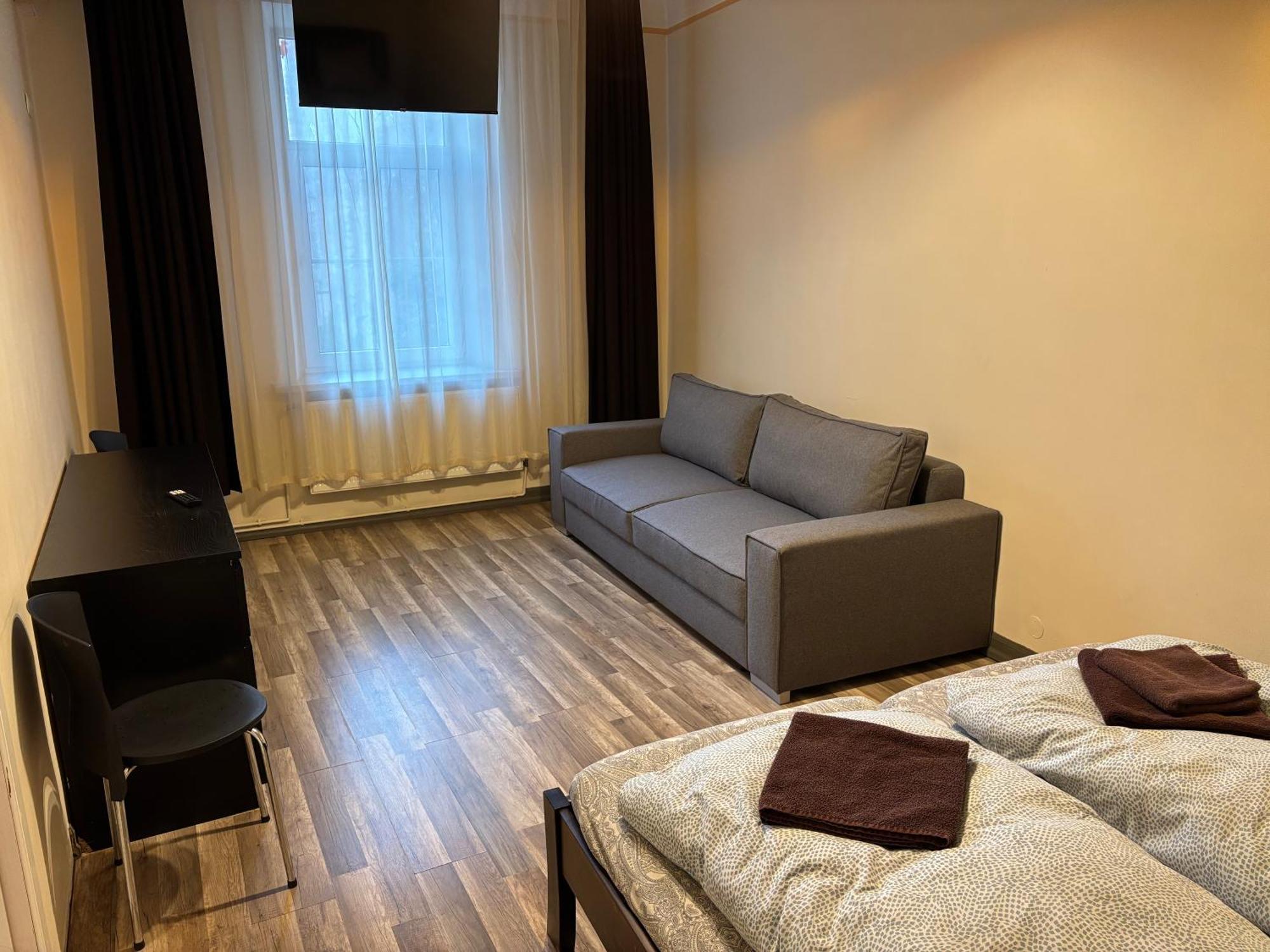 Aparthotel Riga Exterior foto A typical room at the hostel